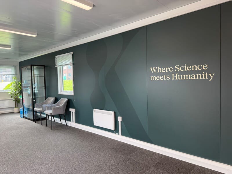 An image of the interior wall graphics, which says "Where Science meets Humanity."